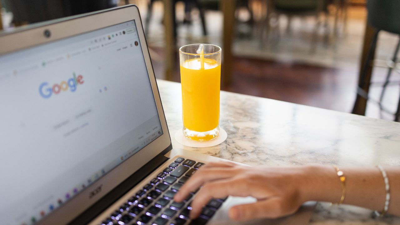 Woman using hotel metasearch engine on laptop